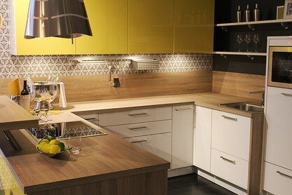 Picture of a kitchen, yellow walls and butcher block countertops