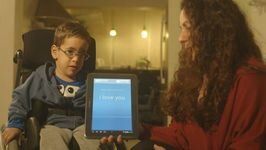 Picture of boy in wheelchair and an iPad with the words 