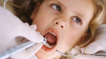 Picture of a child getting a dental checkup